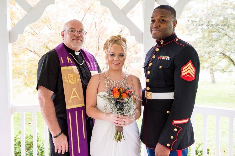 The newlyweds and the officiant