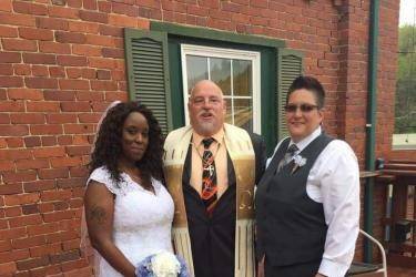 Newlyweds and officiant