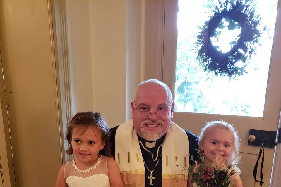 The officiant with children