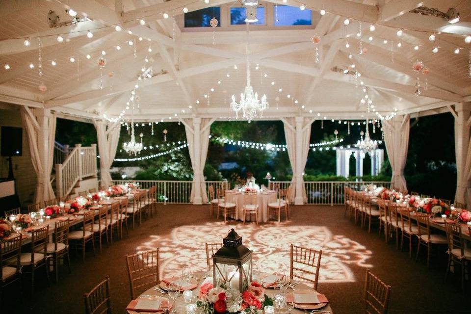 Upscale southern charm in shades of gold, coral and blush. Who wouldn't love to celebrate in this stunning space?