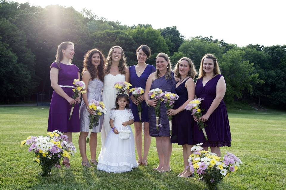 The bride with her bridesmaids and flower girl