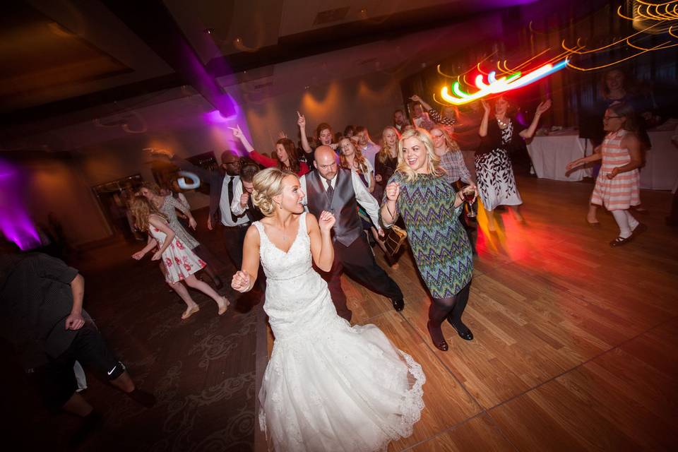 Bride and her guests dancing