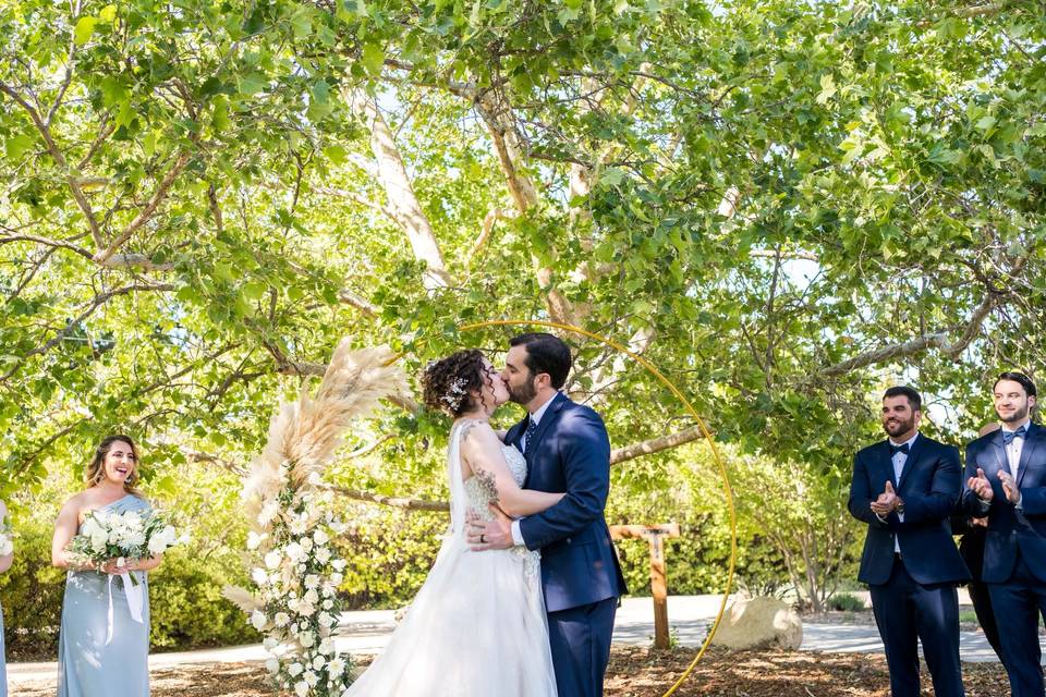 Bride and groom first kiss