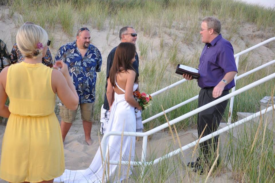 Dan on the stairs officiating Ed and Natalee's Wedding on Lake Michigan in Benton Harbor, Michigan. 08-25-12. (Ed and Natalee in the front).