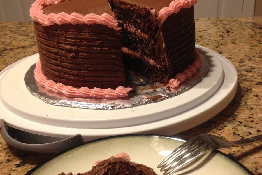 Chocolate cake with chocolate butter cream and strawberry icing.  Absolutely indulge in chocolate, delicious.