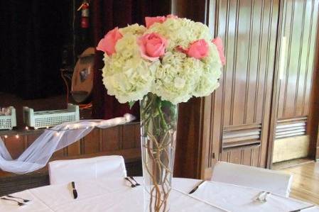 Tall centerpiece of hydrangeas and roses at the Darby House