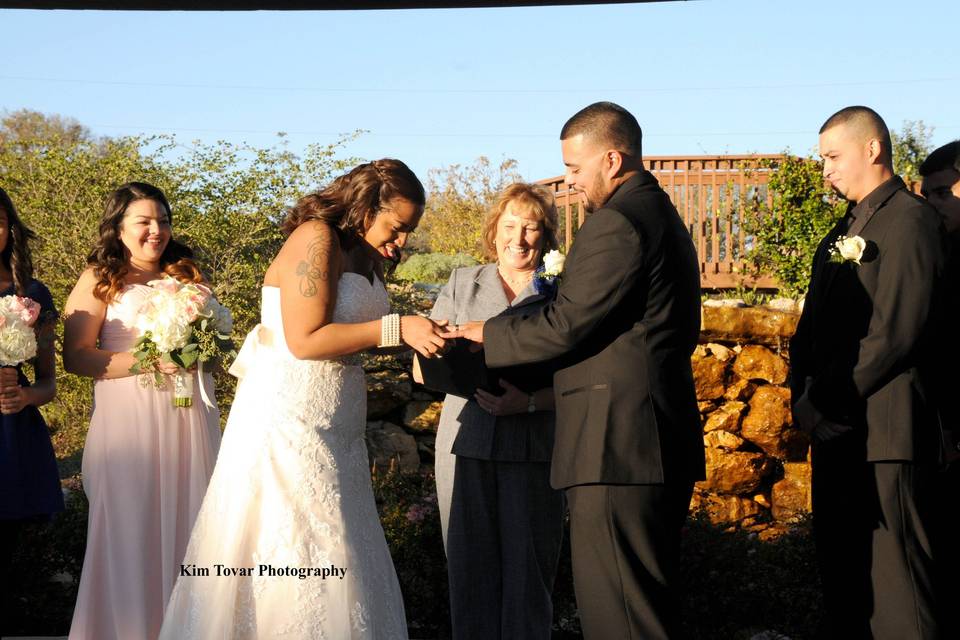 Newlyweds with officiant