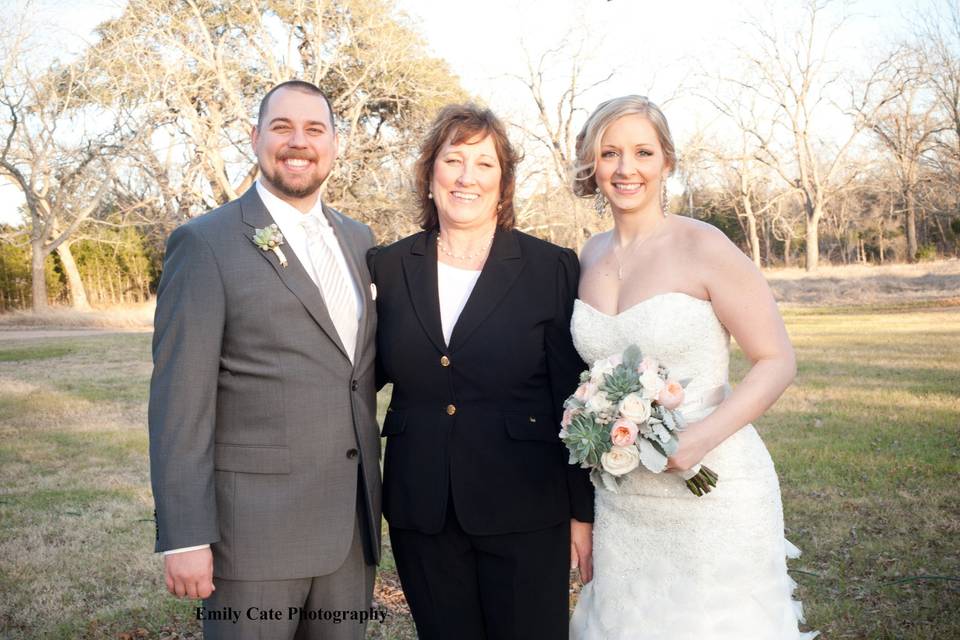 Newlyweds with officiant