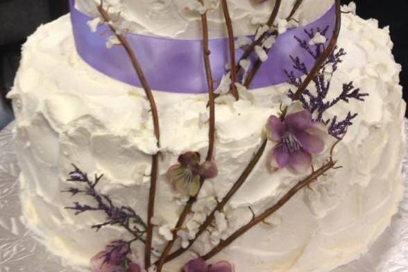 Three tier wedding cake with branch decor
