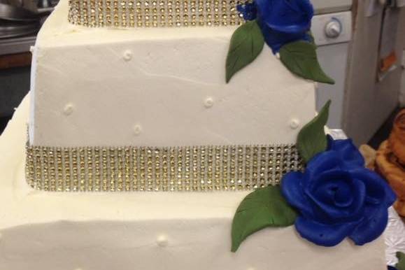 Square cake with blue roses