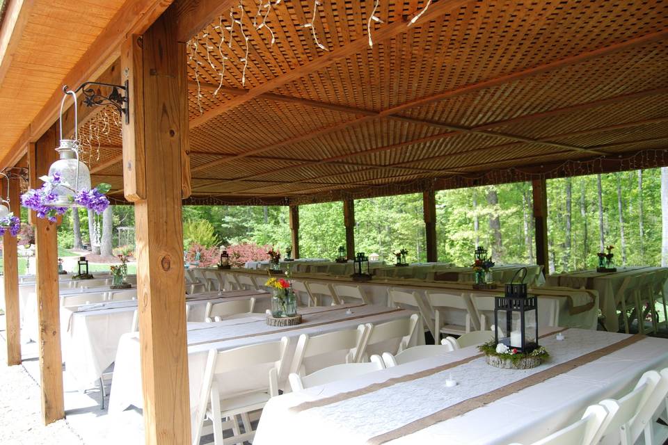 Party pavilion set up with tables and chairs for your decorating theme