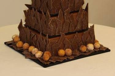 Grooms Cake Chocolate inside with Chocolate Buttercream Icing And 8 Lbs of Hand Cut Chocolate with Donut Hole Accents