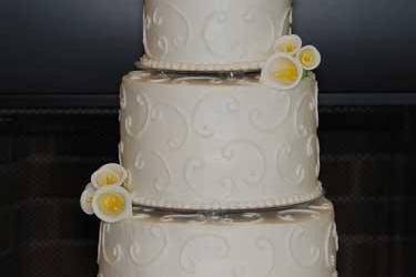 3 Tier White Cake with White Buttercream Icing Light Scroll work with White Lillis