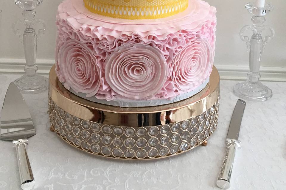2Tier Yellow Cake With White Buttercream Icing Pink Bands and Small Pink Hand Made Flowers