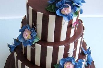 Chocolate fondant iced cake with hand-crafted sugar flowers and butterflies