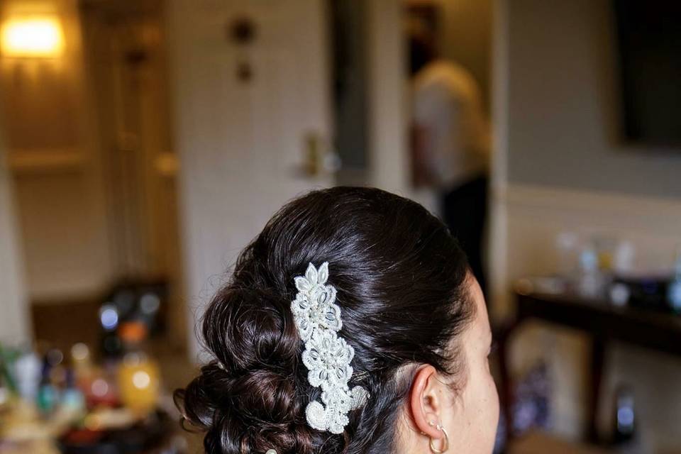 Curled wedding hair with accessory