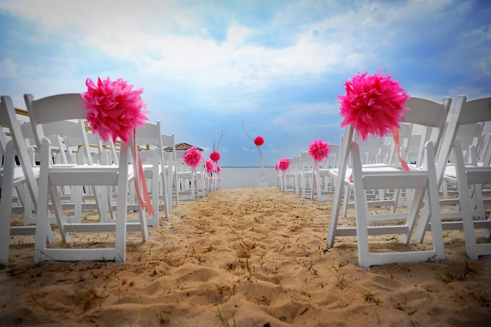 Pink flower decor for the wedding chairs