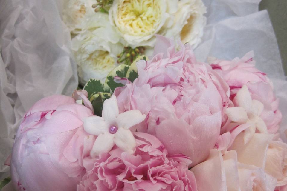 Soft peonies and garden roses