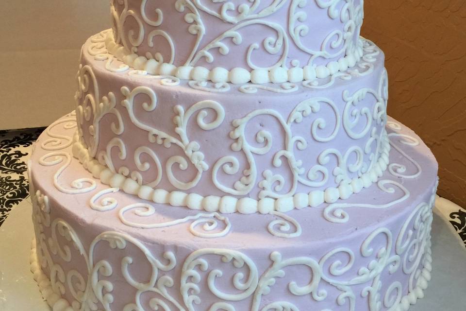 Four tier scroll on pink with Très Chic Bakery