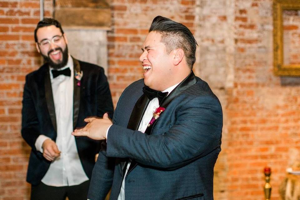 Groomsman gettin it as the Groom cheers him on