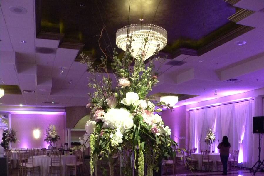 Table setup with tall floral centerpiece