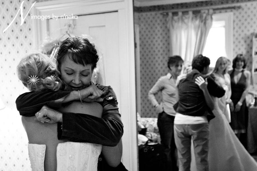 Tender hug between a bride and her mother
