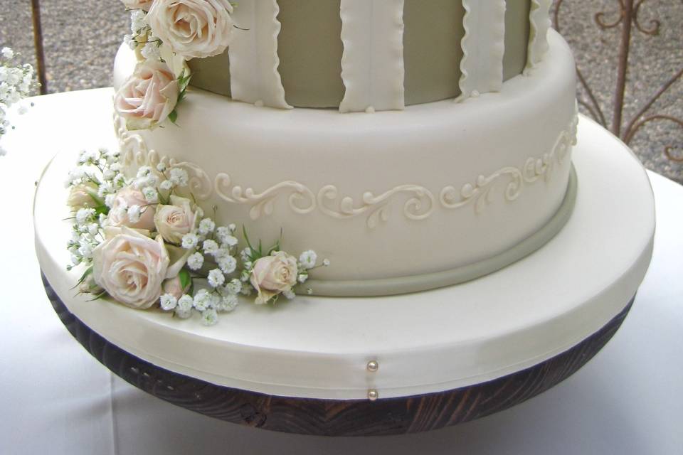 3-tier wedding cake with striped middle layer