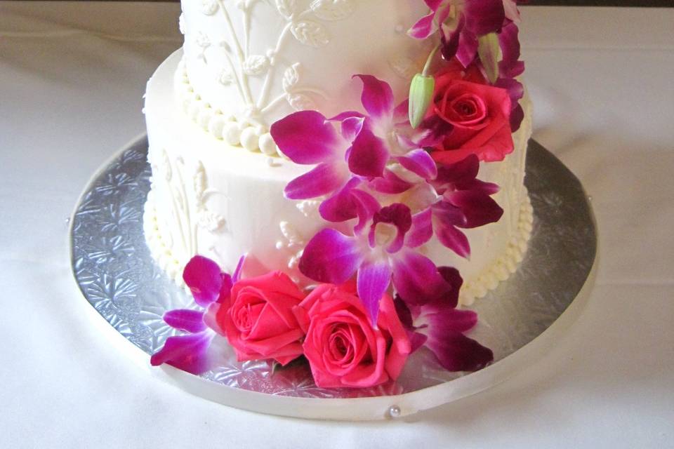 3-tier wedding cake with pink petals