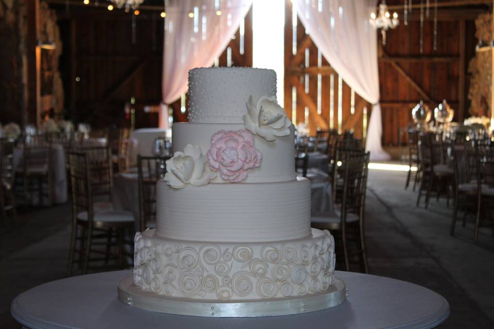 4-tier wedding cake with floral details
