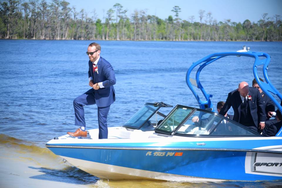 The groom's arrival by boat!