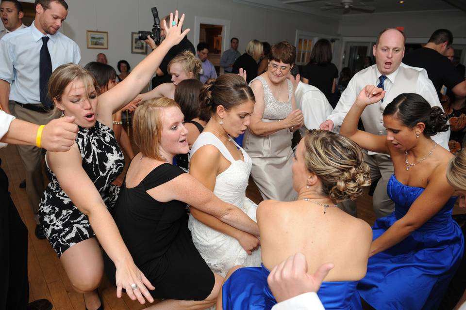 Bride and guests dancing