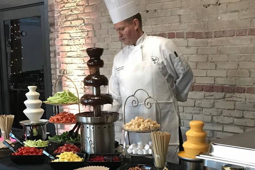 Chocolate fountain and fruits