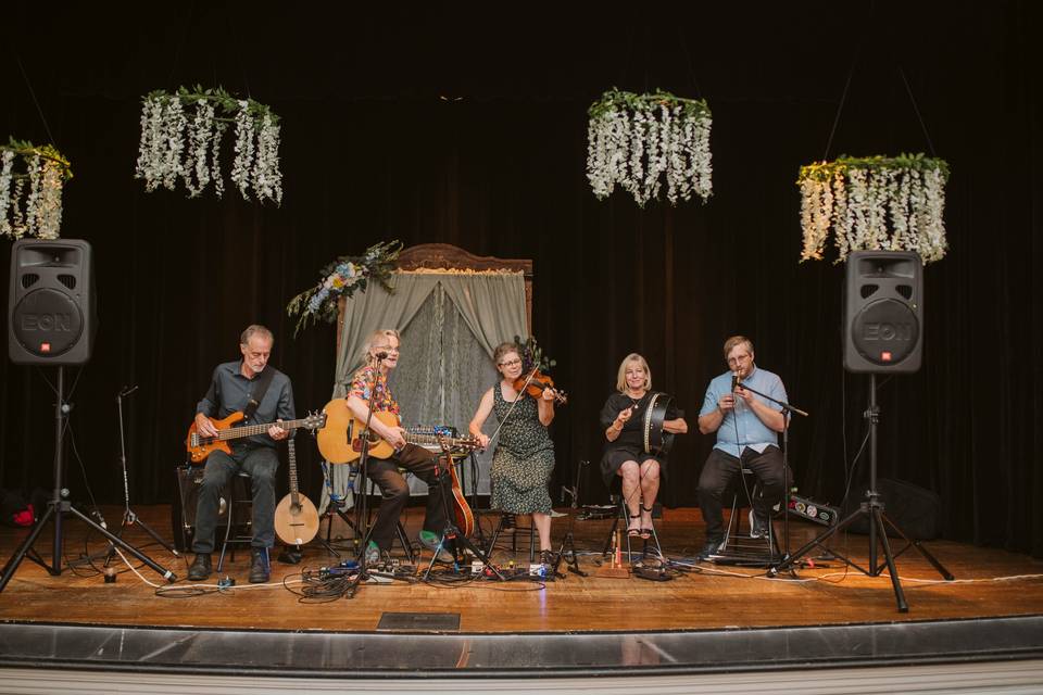 Band on stage at the wedding