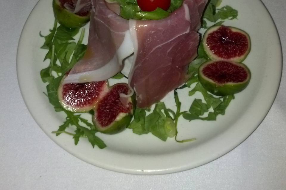 One of many options for your catering event. Prosciutto and fresh figs over arugula salad