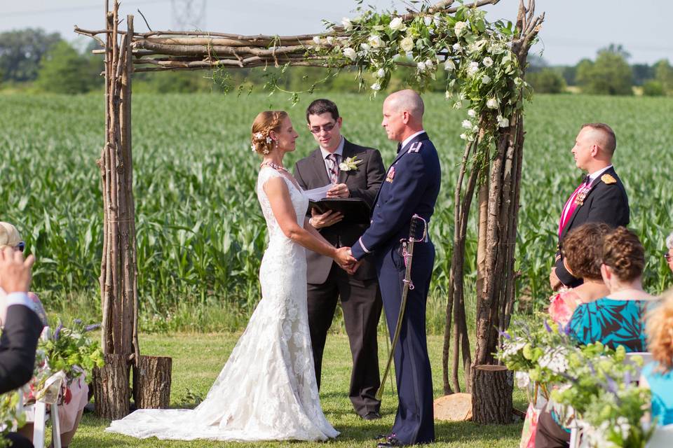 Wedding ceremony​ by cornfield