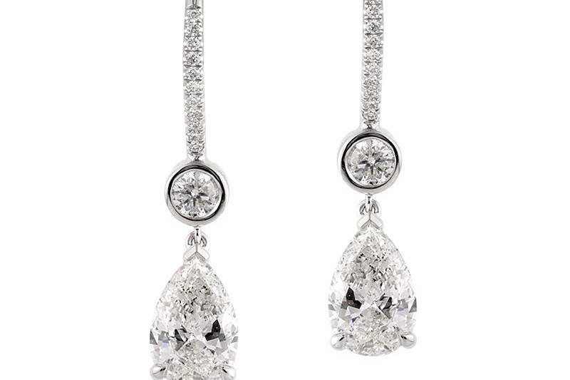 <b>3.83ctw Pear Shaped Diamond Dangle Earrings</b><br>
This exceptionally beautiful pair of pear shaped and round diamond statement earrings possess a jaw-dropping, bold look.