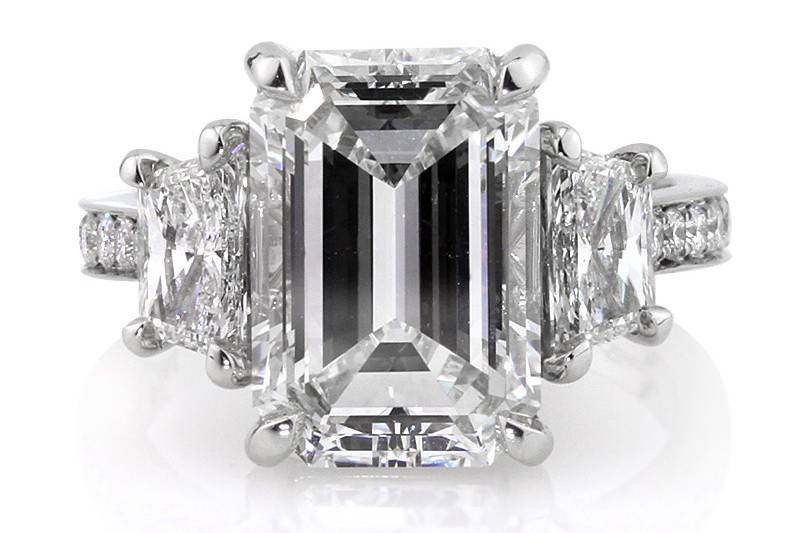 <b>7.18ctw Emerald Cut Diamond Engagement Anniversary Ring</b><br>
This enchanting emerald cut diamond ring features bright trapezoids and white round diamonds in a hand set pave setting.
