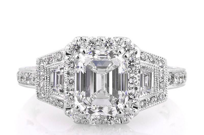 <b>3.00ctw Emerald Cut Diamond Engagement Anniversary Ring</b><br>
This extraordinary emerald cut diamond ring has lovely milgrain detail all over and hand set trapezoid side diamonds.