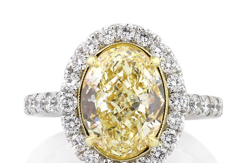 <b>5.30ctw Fancy Yellow Oval Cut Diamond Engagement Anniversary Ring</b><br>
This outstanding fancy yellow oval cut diamond halo ring has great little details such as diamonds on the connectors.