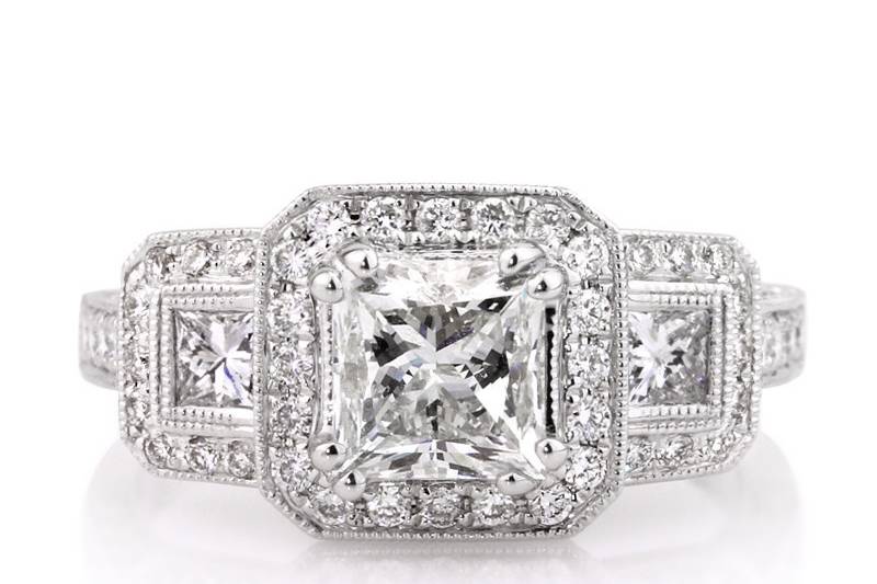 <b>2.60ctw Princess Cut Diamond Engagement Anniversary Ring</b><br>
This extraordinary three-stone princess cut diamond halo ring features elegant handmade milgrain detail throughout.