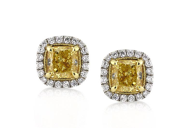 <b>2.52ctw Fancy Yellow Cushion Cut Diamond Stud Earrings</b><br>
This delightful pair of fancy yellow cushion cut diamond halo earrings feature a unique hand engraved gold basket.