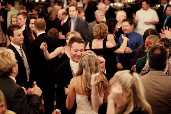 Couple with the guests dancing