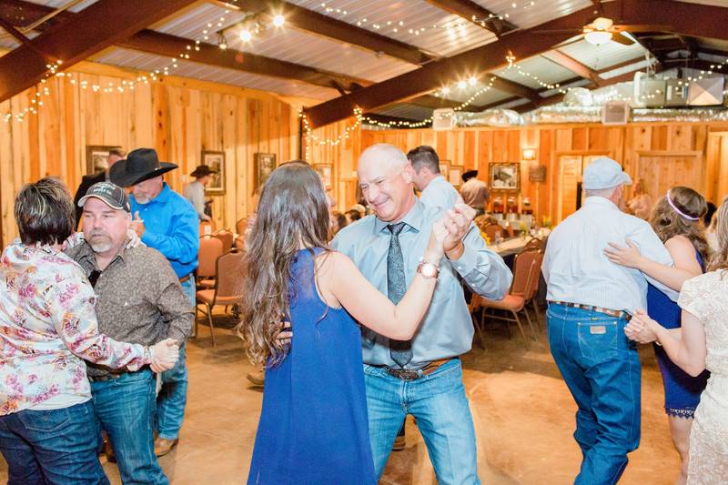 Couple with the guests dancing