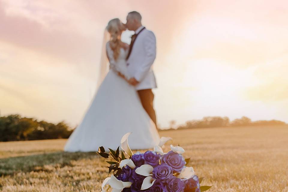 Kiss and bouquet on grass