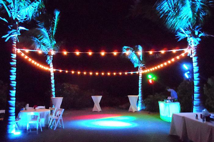 4-In-One: Wedding ceremony audio (about 200 feet out of view), Wedding reception audio, 6-foot screen (4:3 ratio) and projector (3,500 lumens), Mediterranean Breeze string lighting for small group at Seven Stars Resort for Jenny and Jonathan's wedding on October 5, 2014 on Gracebay Beach, Turks & Caicos Islands at sunset.