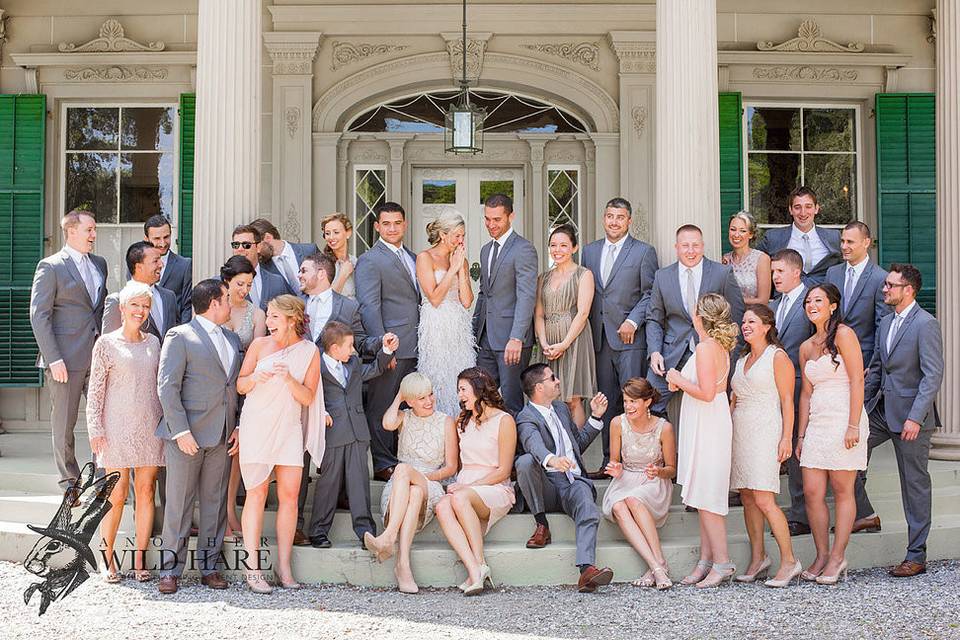 The couple with the bridesmaids and groomsmen