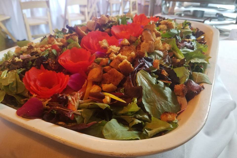 Fresh salad topped with florals