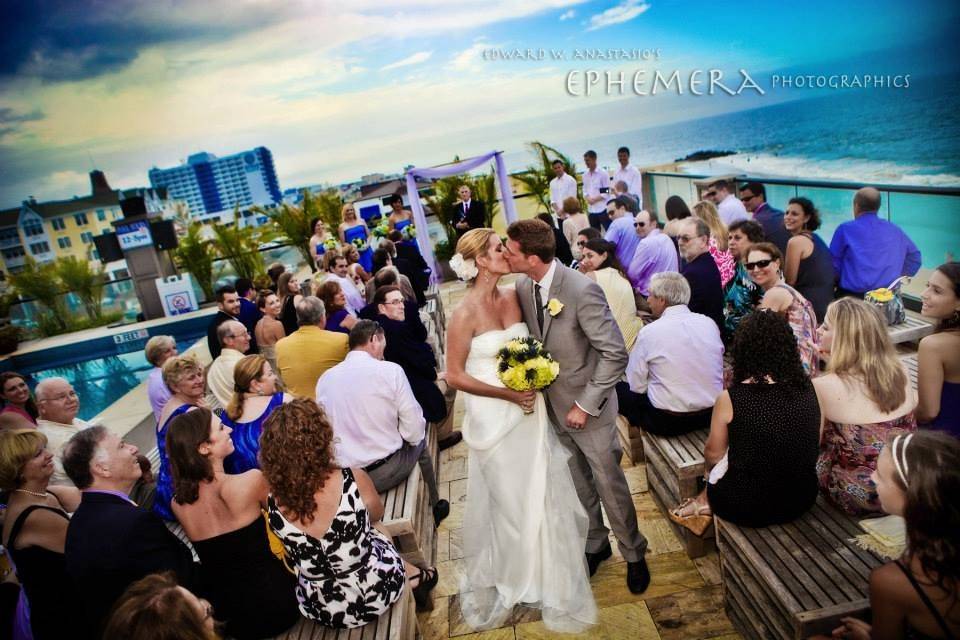 Newlyweds kissing at the aisle