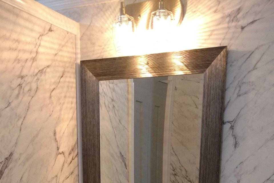 Deluxe Suite Men's marble topped vanity in luxury restroom trailer