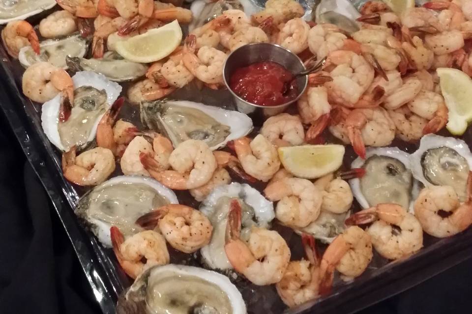 Seafood Bar with Oysters on the Half Shell and Shrimp Cocktail Served in Ice Sculputre